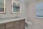 Primary ensuite bathroom with double sinks 